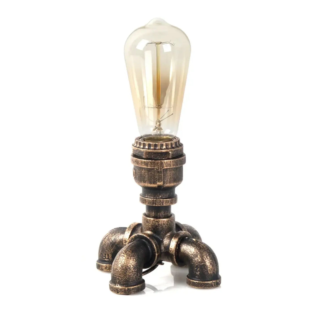 Lampe de table forge style industriel avec base en tuyau finition laiton et ampoule edison ambre pour décoration intérieure et ambiance chaleureuse
