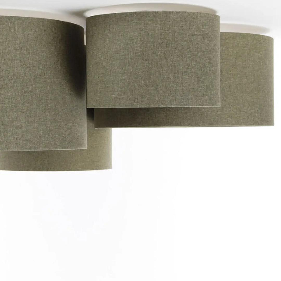 Luminaire plafonnier with four olive-green fabric lampshades featuring a natural textured woven appearance