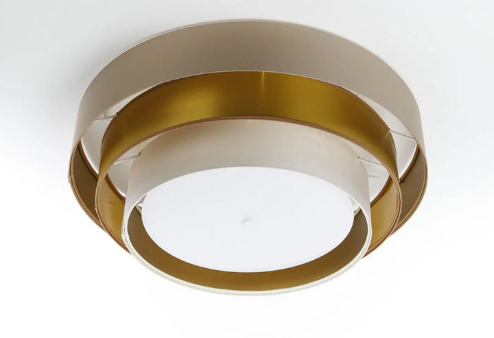 Luminaire plafonnier beige moderne avec anneaux concentriques en métal doré brossé et beige mat triniti elegant