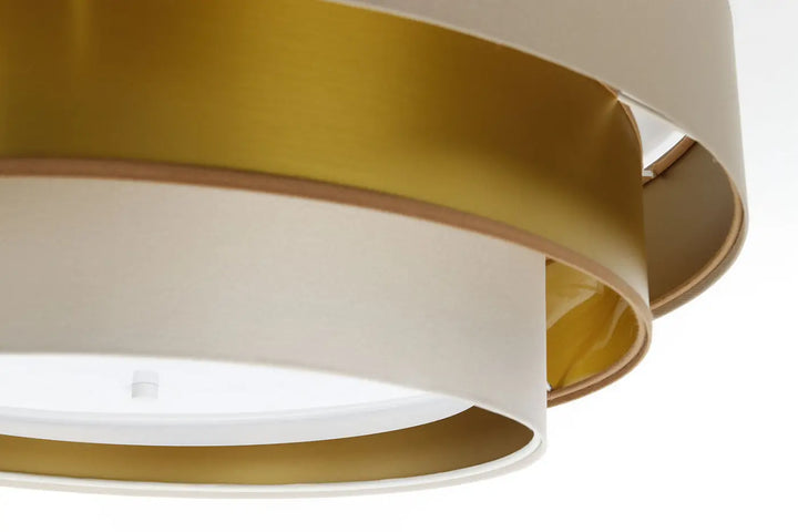 Luminaire plafonnier beige triniti elegant avec anneaux concentriques en métal blanc mat et doré brossé moderne