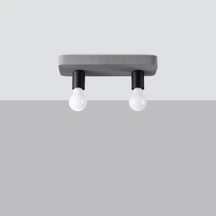 Plafonnier tavo moderne en béton gris avec deux fixations noires et douilles blanches pour une ambiance unique