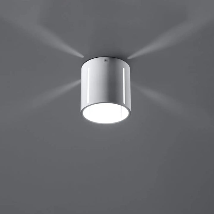 Luminaire plafonnier inez blanc cylindrique avec design moderne et formes géométriques à spectacle lumineux subtil