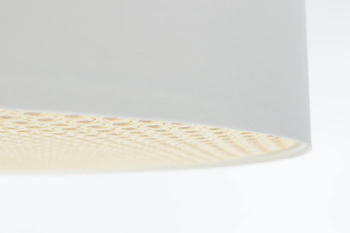 Luminaire plafonnier blanc perle avec abat-jour cylindrique minimaliste et perforations circulaires texturées