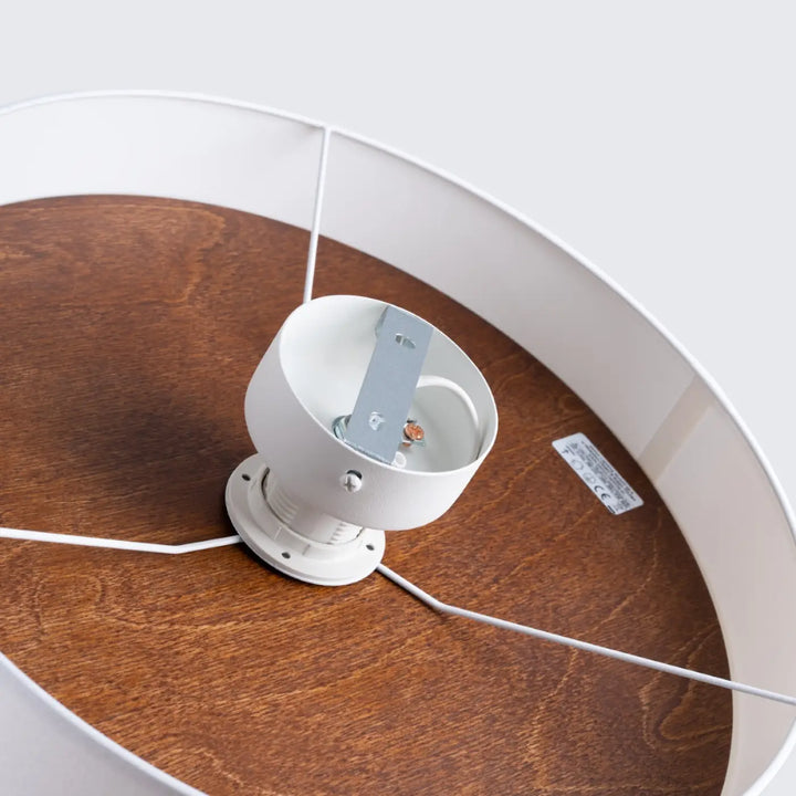 Plafonnier telesto blanc avec base circulaire en bois marron foncé et support métallique design minimaliste