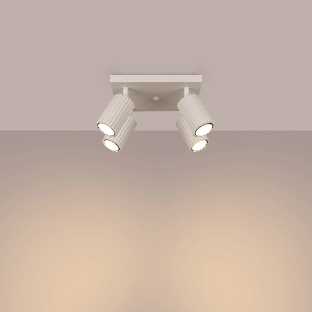 Plafonnier karbon beige avec quatre têtes cylindriques réglables à ampoules gu10 interchangeables design minimaliste