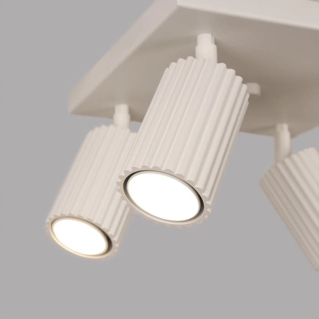 Plafonnier karbon beige avec quatre ampoules gu10 interchangeables et design minimaliste cylindrique blanc