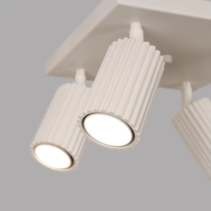 Plafonnier karbon beige avec quatre ampoules gu10 interchangeables et design minimaliste cylindrique blanc