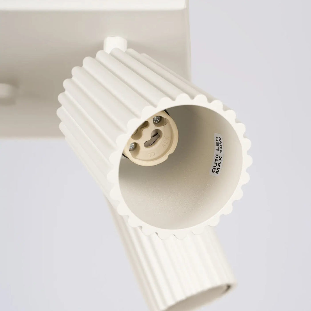 Plafonnier Karbon 4 beige avec ampoules gu10 interchangeables design minimaliste et corps cylindrique blanc nervuré