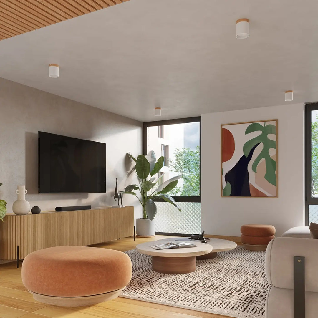 Salon moderne minimaliste avec console en bois naturel sous plafonnier rif blanc et ottomane orange pour solutions déclairage modernes