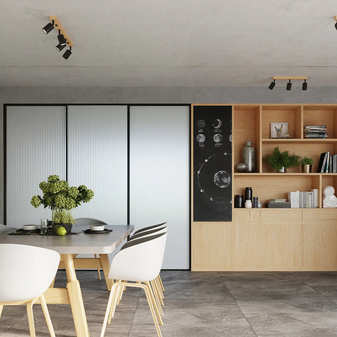 Table à manger moderne minimaliste avec plateau en béton et pieds en bois clair sous plafonnier verdo design moderne blanc