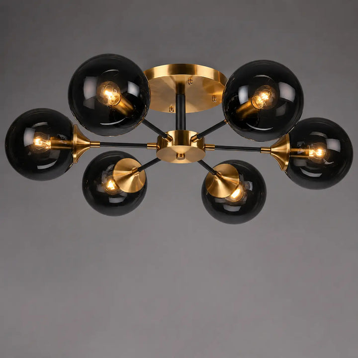 Plafonnier à branches ambrina en verre noir avec métal doré et ampoules led à filament exposé moderne
