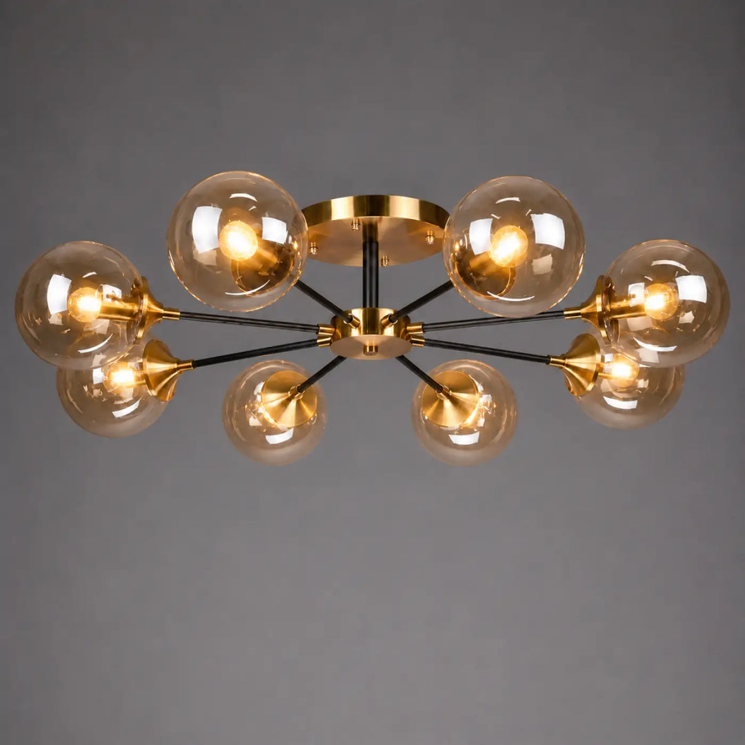 Plafonnier à branches modern en métal doré et noir avec six globes en verre ambre et ampoules led ambrina