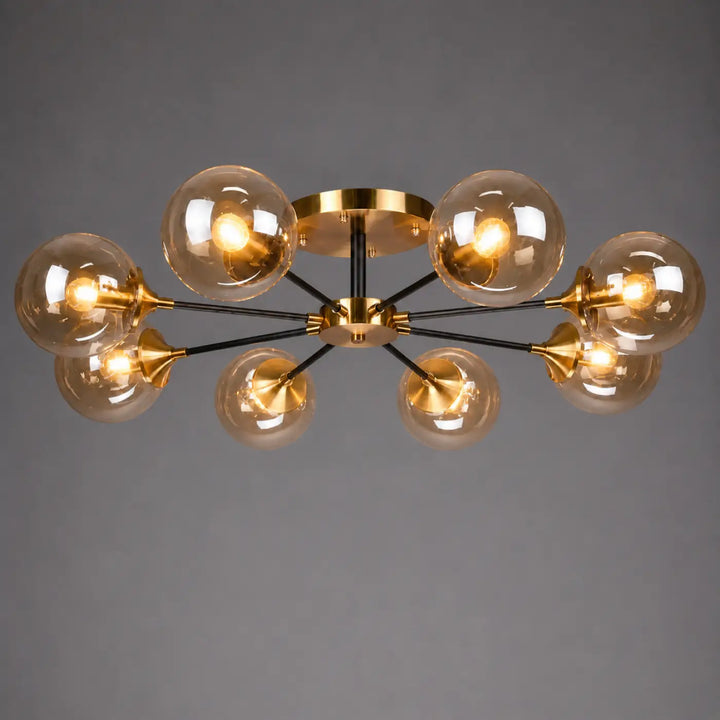 Plafonnier à branches modern en métal doré et noir avec six globes en verre ambre et ampoules led ambrina