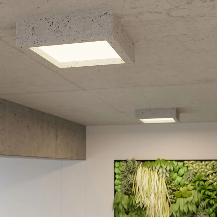 Luminaire plafonnier riza en béton moderne avec panneau blanc encastré pour aménagements industriels et atmosphère harmonieuse
