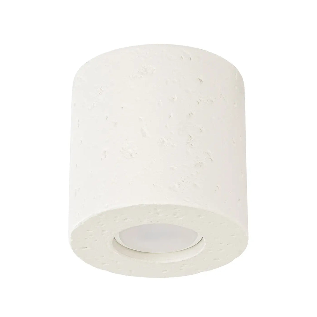 Plafonnier orbis beige cylindrique en béton texturé avec panneau led encastré forme moderne et accent décoratif unique