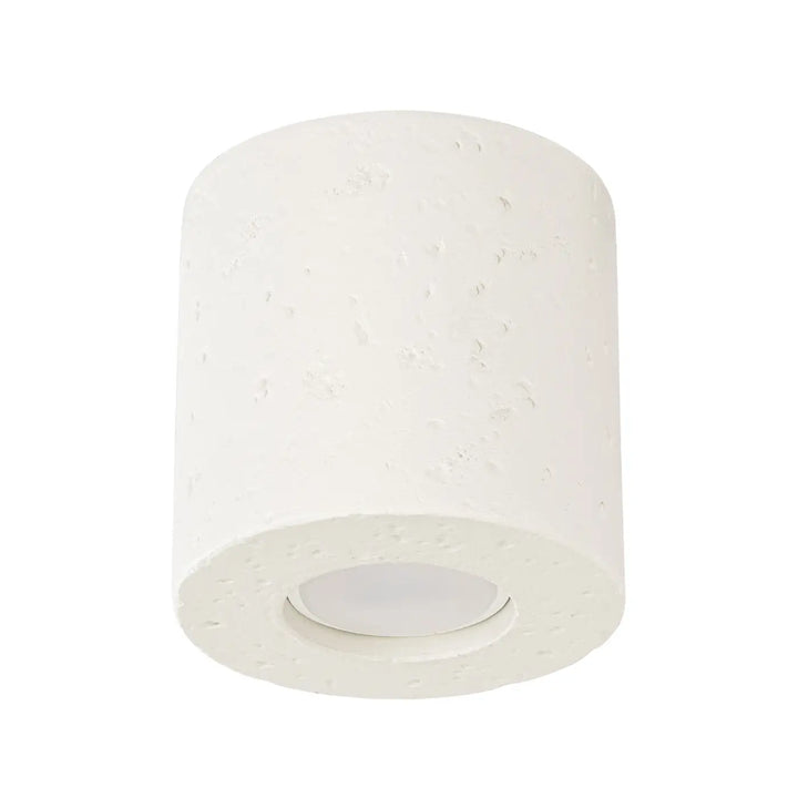 Plafonnier orbis beige cylindrique en béton texturé avec panneau led encastré forme moderne et accent décoratif unique