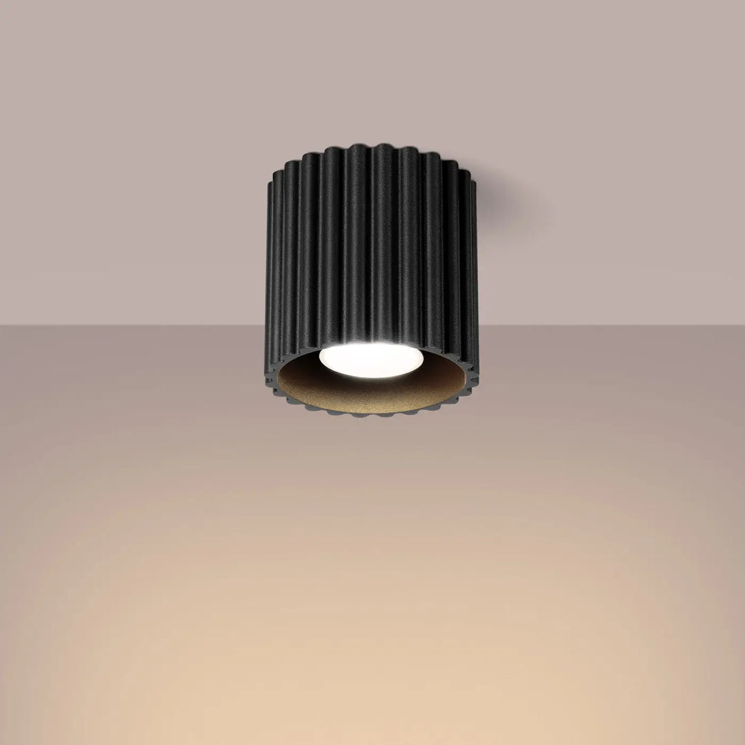 Luminaire plafonnier aura 1 noir avec ampoule led blanc chaud et forme unique inspirée à texture cannelée