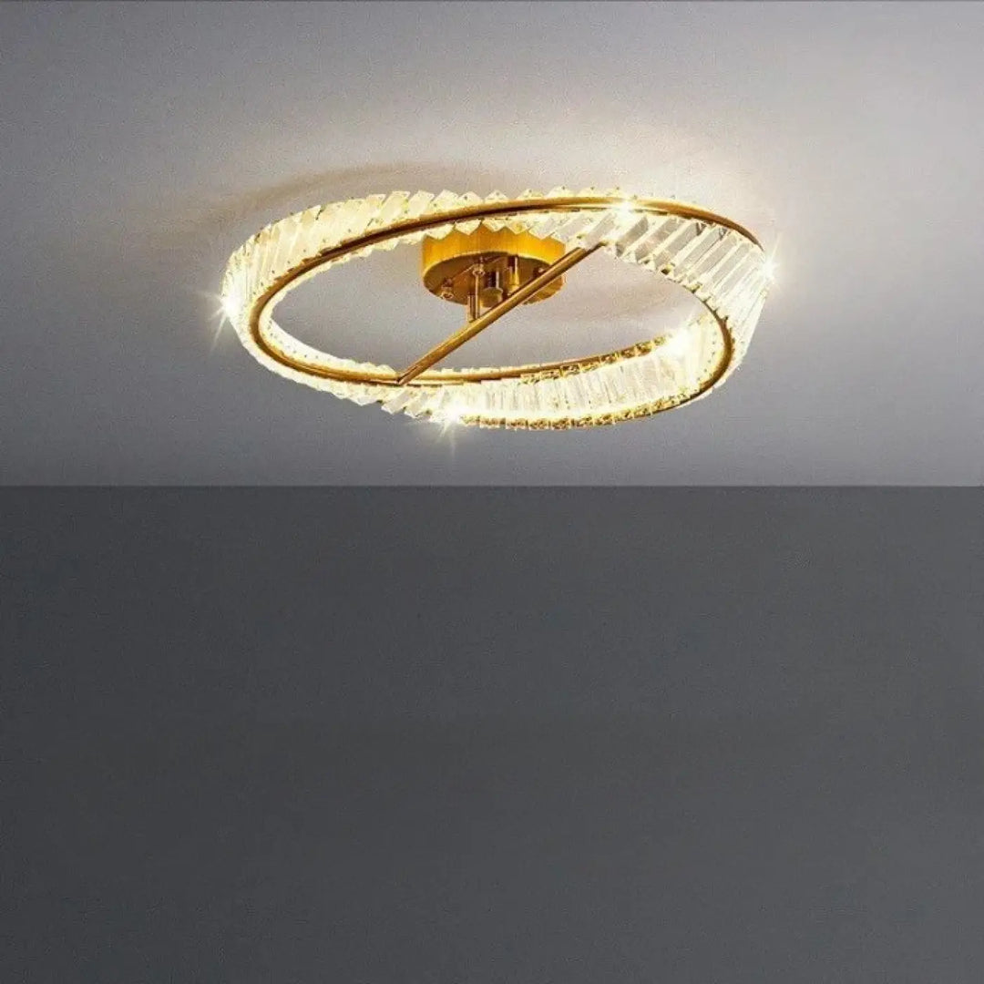 Luminaire plafonnier atlys en métal doré avec deux anneaux concentriques ornés de cristaux facettés design élégant