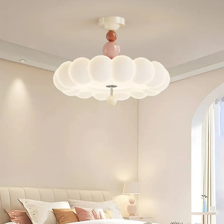 Luminaire plafonnier petalya design en forme de nuage blanc doux avec accents sphériques rose et terracotta en verre dépoli