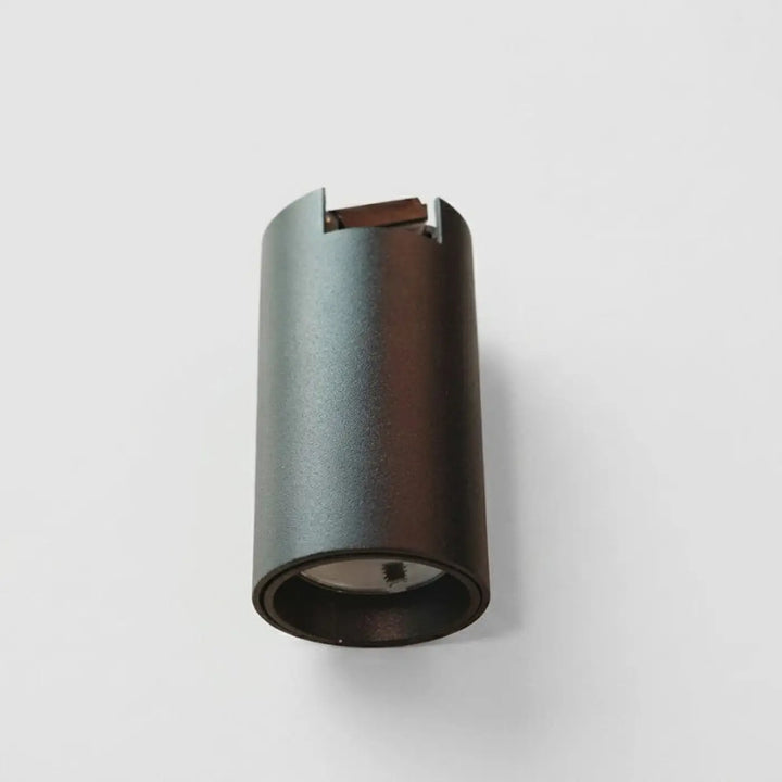 Luminaire plafonnier moderne gris foncé cylindrique en led avec finition mate et composants internes visibles
