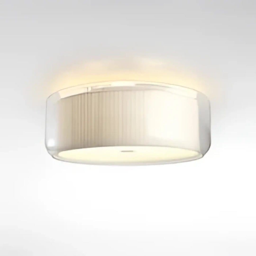 Luminaire plafonnier oreane avec abat-jour cylindrique en verre dépoli à ridges verticales contribue à créer une ambiance moderne