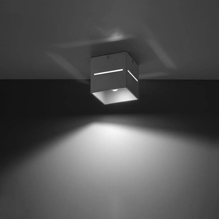 Plafonnier lobo gris moderne avec finition métallique et perforation linéaire dispersera un spectacle lumineux minimaliste