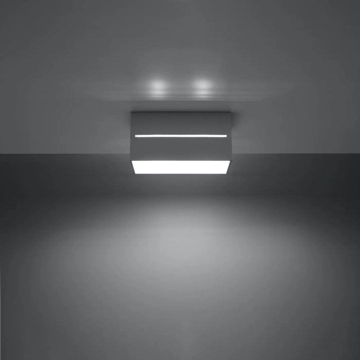 Plafonnier lobo 2 gris moderne avec finition blanche et perforation linéaire pour un spectacle lumineux minimaliste
