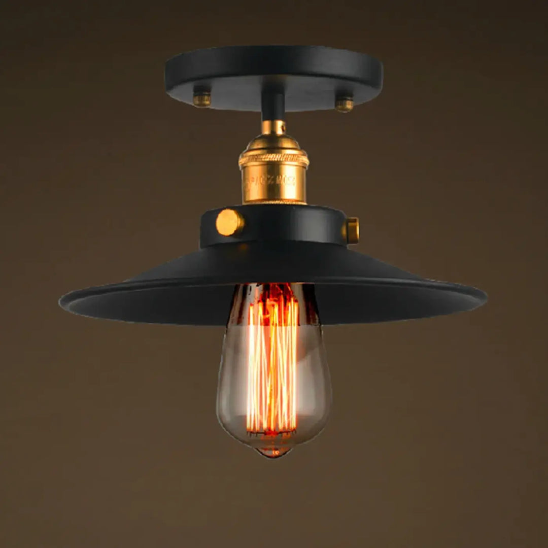 Luminaire plafonnier style industriel noir avec douille finition laiton et ampoule edison pour décoration intérieure