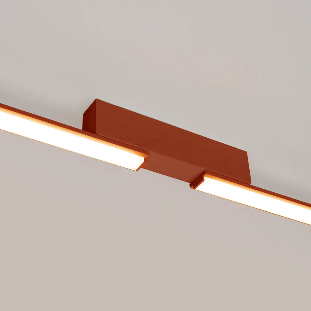 Luminaire plafonnier lagom 3000k rouge ocre en cuivre avec deux bandes led éclairées design minimaliste excellente finition collection lagom allie