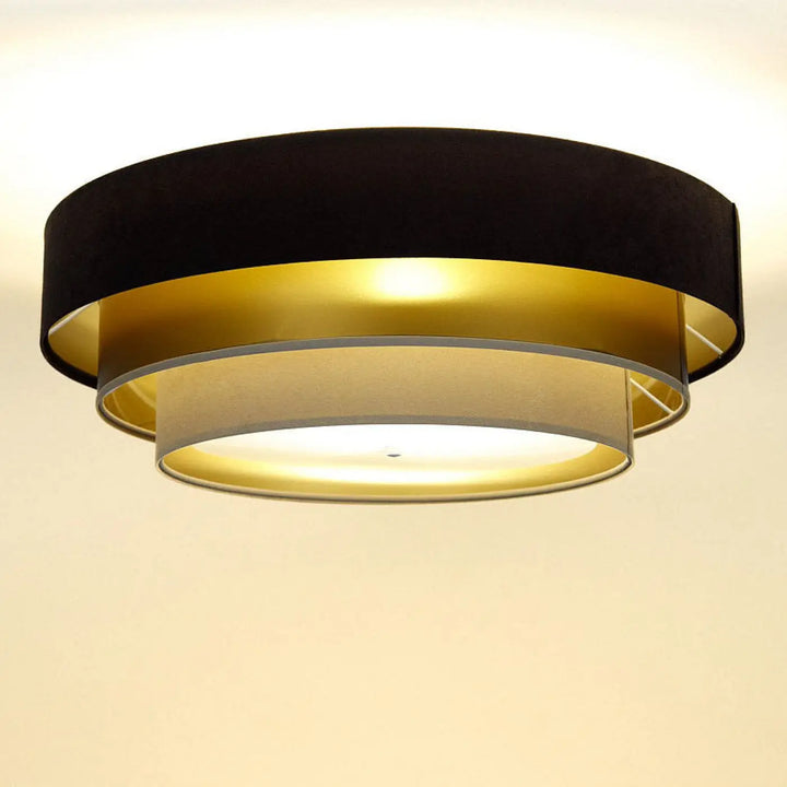 Luminaire plafonnier marron avec design en couches en velours noir, accents métalliques dorés et abat-jour beige