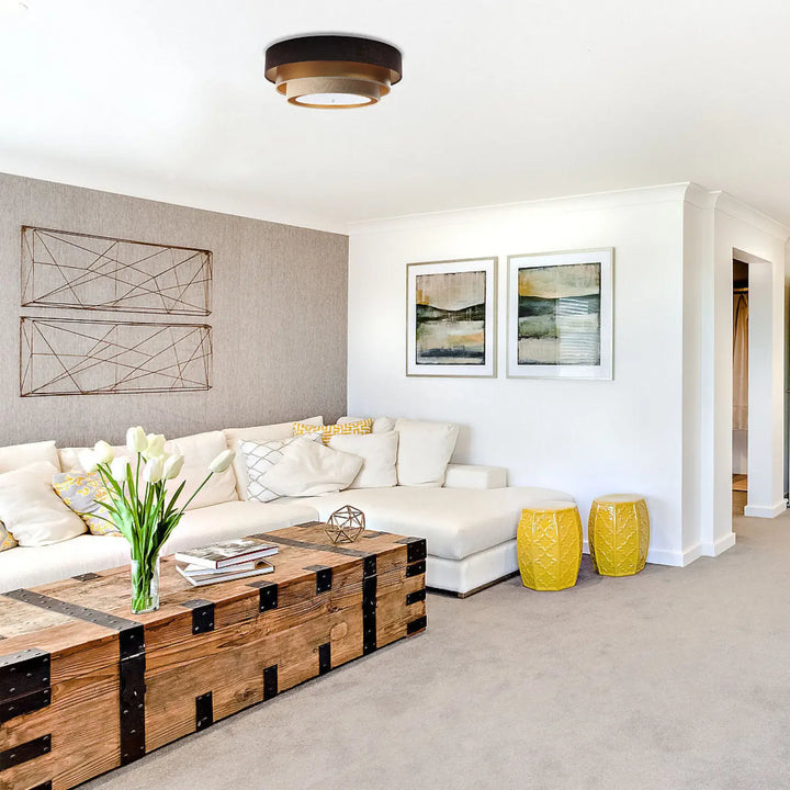 Rustic wooden coffee table with black metal accents complements the luminaire plafonnier marron triniti elegant design