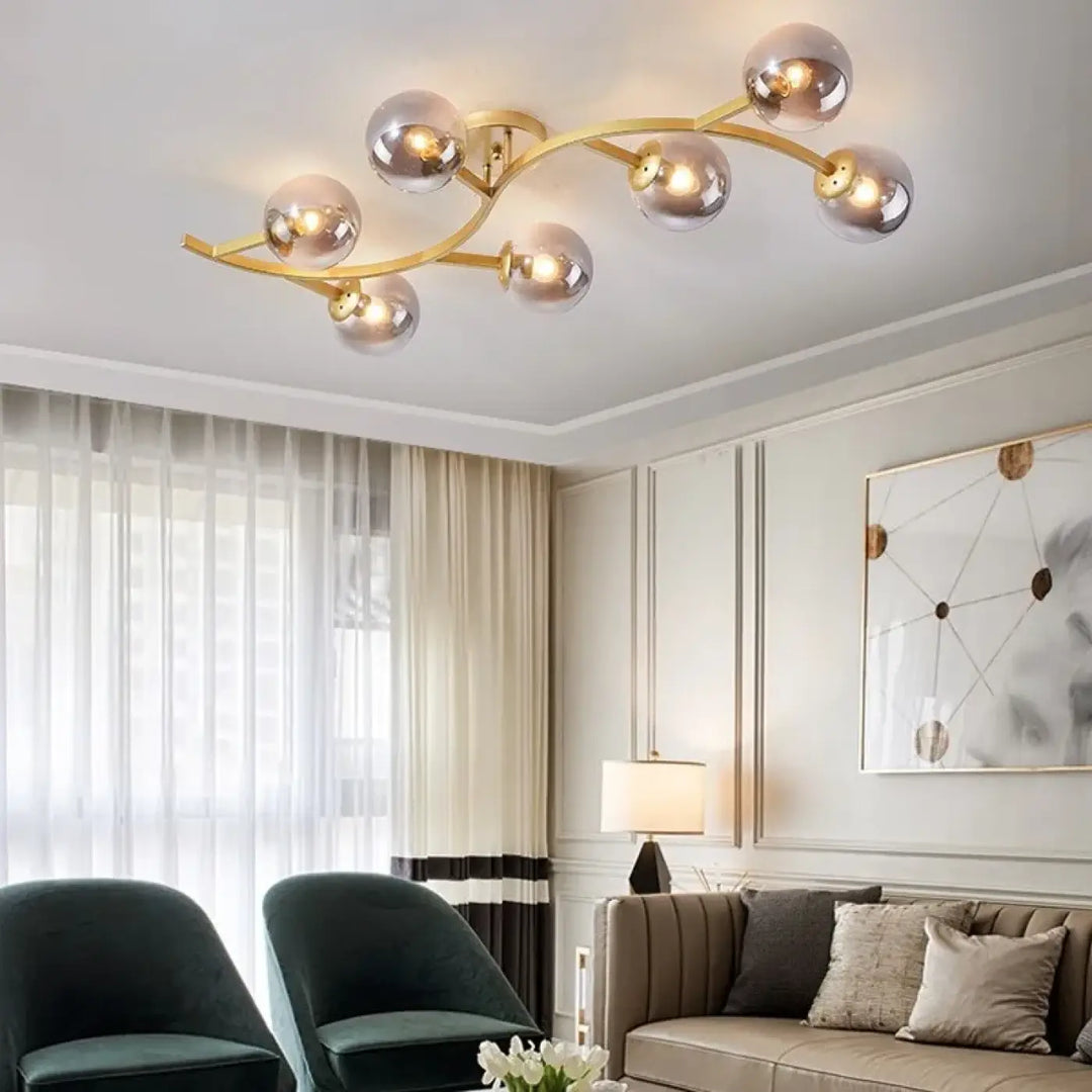 Luminaire plafonnier métal doré avec boules en verre moderne