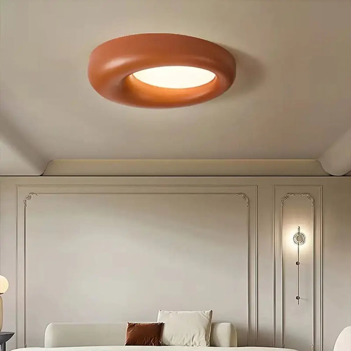 Luminaire plafonnier torix led style circulaire terracotta mat avec centre lumineux blanc pour intérieur moderne
