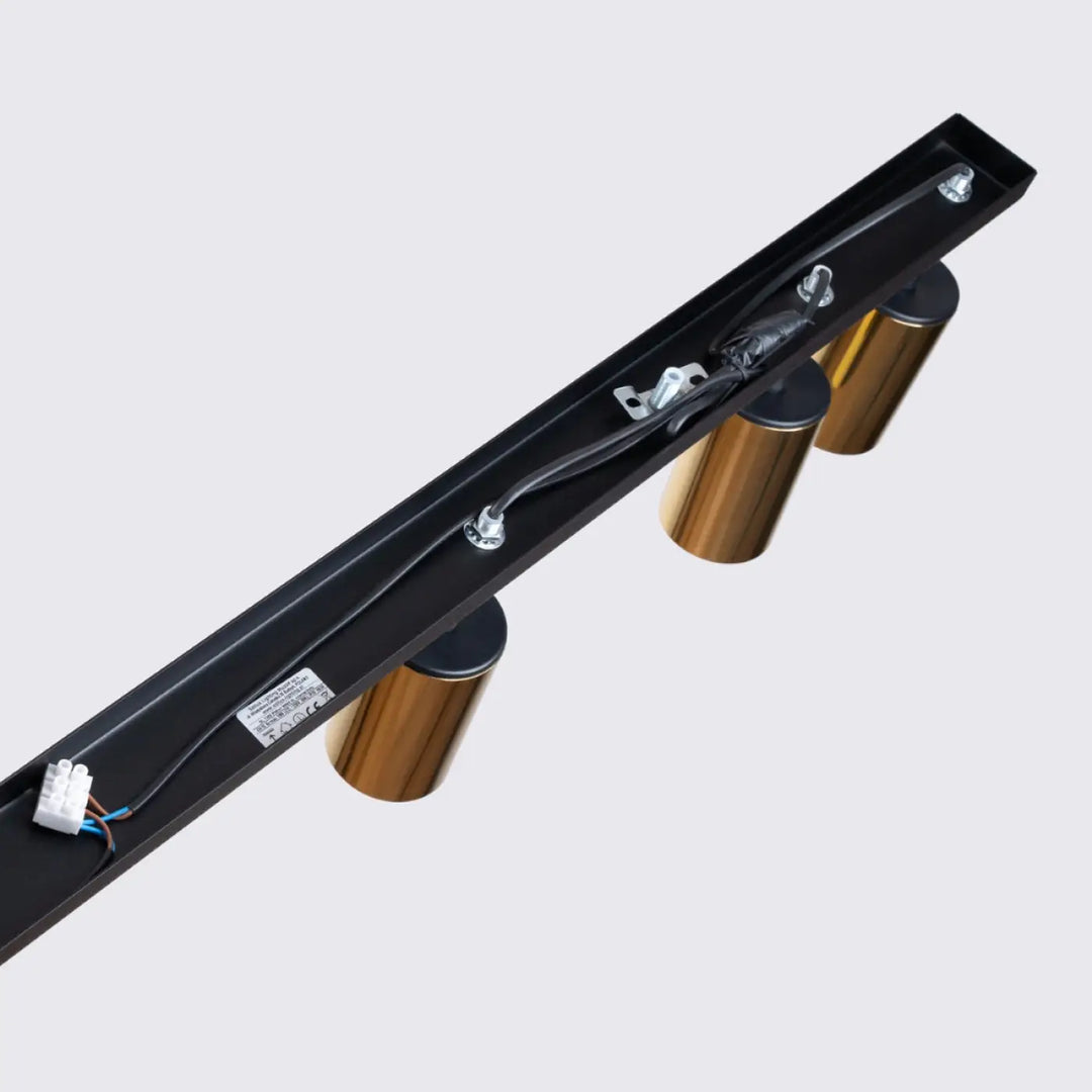 Luminaire plafonnier winx 6l noir avec trois cylindres dorés sur rail métallique noir design winx allie