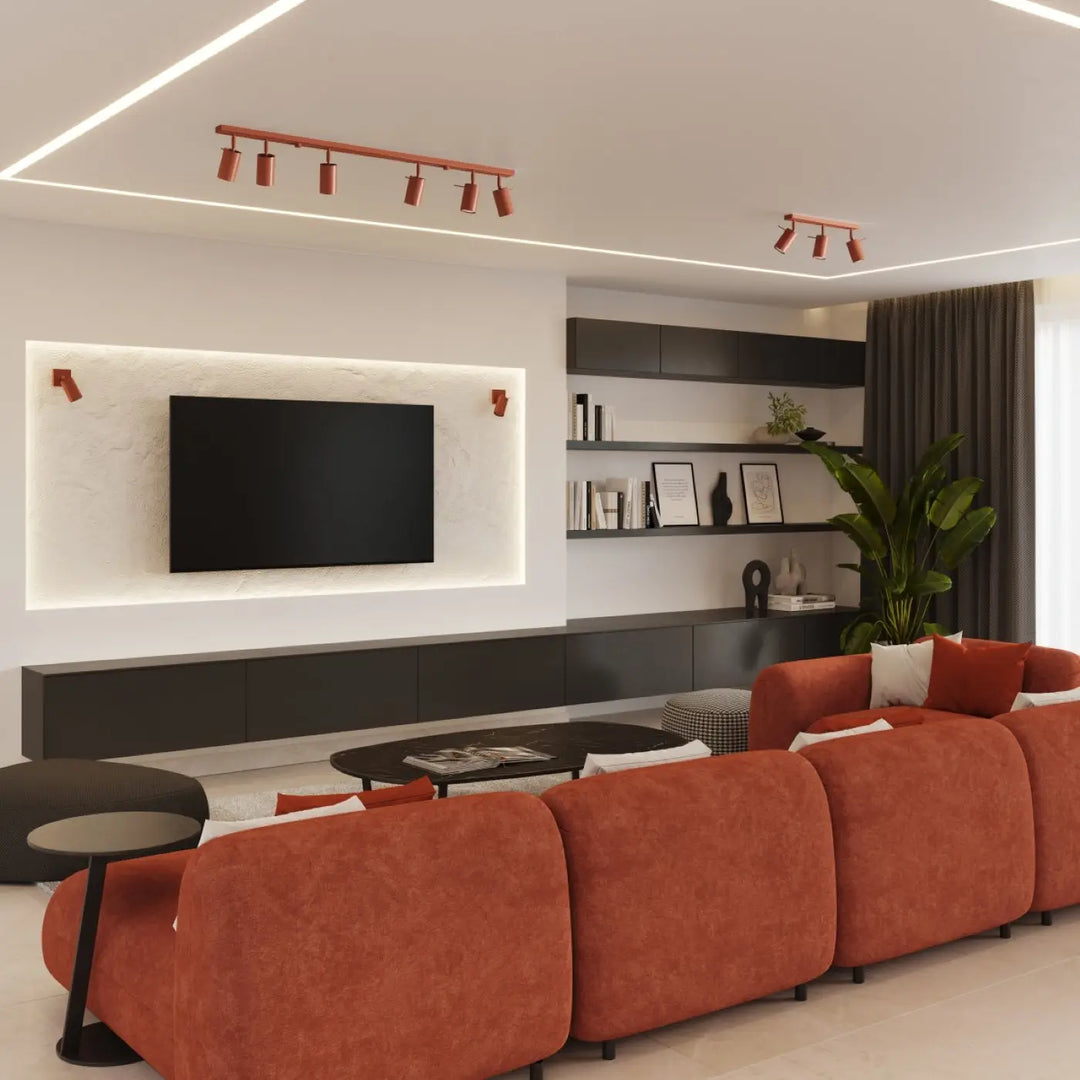 Orange upholstered sectional sofa with rounded back cushions and dark metal legs featured with lampe ring for minimalisme moderne éclairage flexible