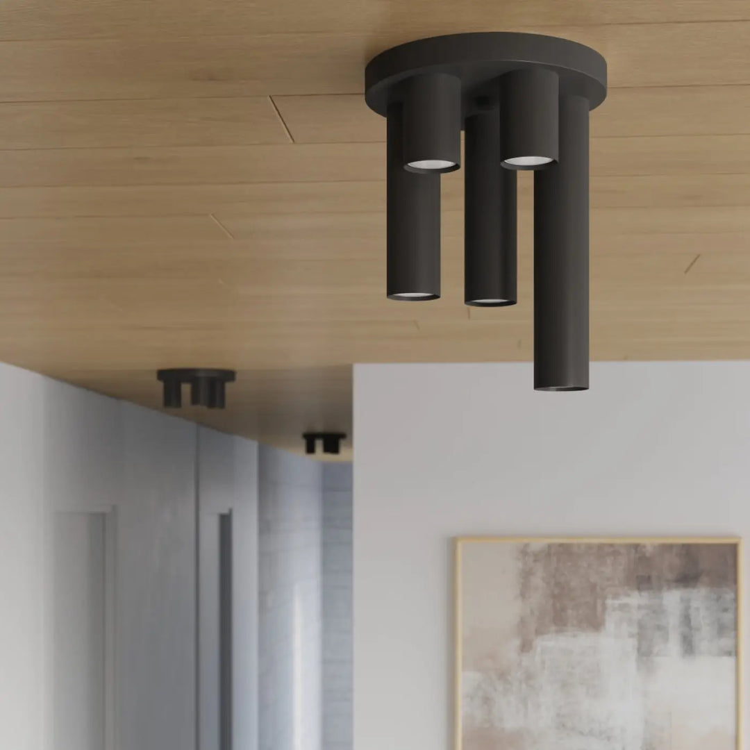 Plafonnier lagos noir moderne avec trois bras verticaux cylindriques pour un caractère chic et élégant