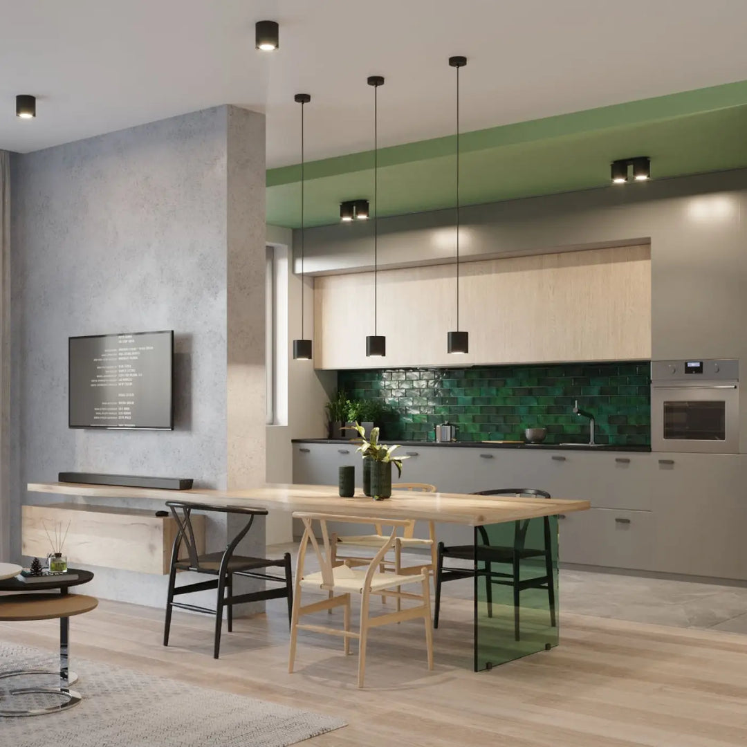 Plafonnier orbis noir suspendu dans une cuisine moderne avec crédence verte et meubles en bois naturel