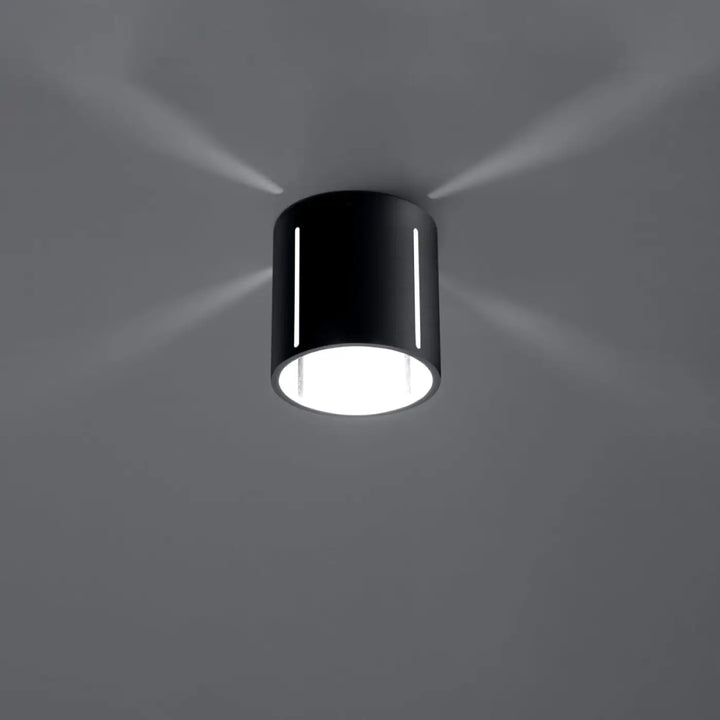 Plafonnier inez noir cylindrique avec perforation linéaire et spectacle lumineux blanc éclatant intérieur
