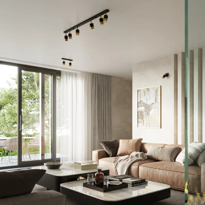 Luminaire plafonnier moderne noir avec accents dorés de la collection nero offrant totale liberté d’éclairage