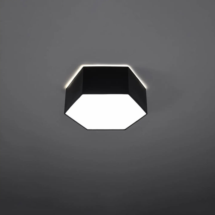 Luminaire plafonnier sunde 11 noir avec forme géométrique hexagonale et face lumineuse blanche éclatante