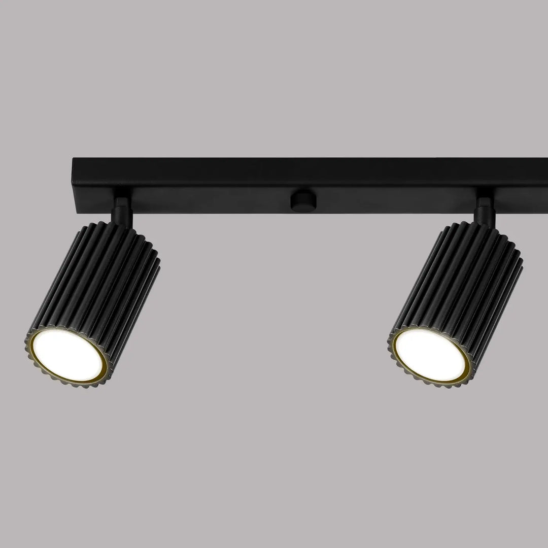 Plafonnier karbon allie design minimaliste avec deux têtes cylindriques noires et ampoules gu10 interchangeables