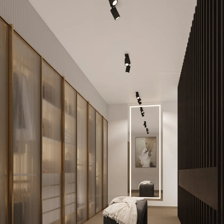 Plafonnier karbon allie design minimaliste avec ampoules gu10 interchangeables noir à têtes ajustables sur plafond blanc