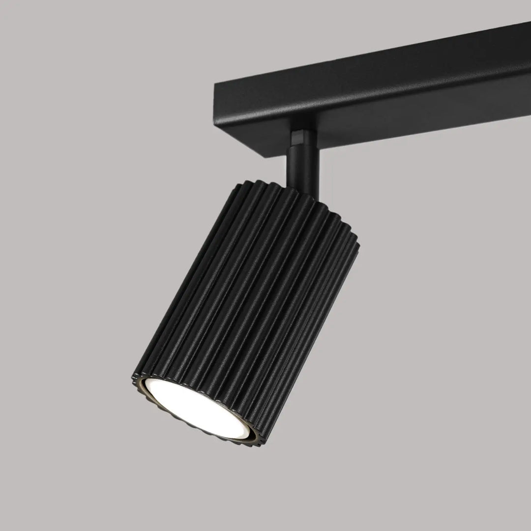 Plafonnier karbon allie design minimaliste et ampoules gu10 interchangeables en noir avec finition cannelée