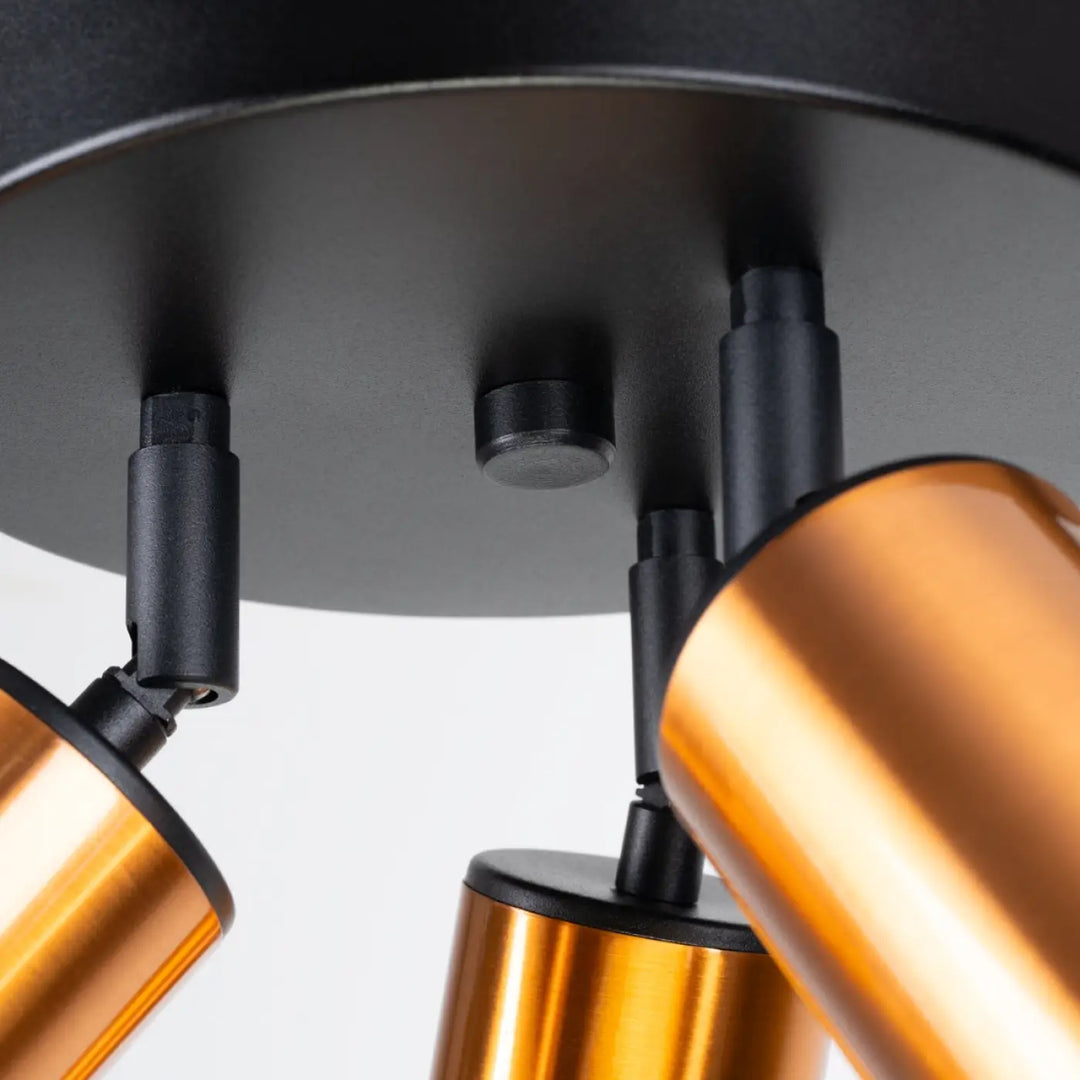 Modern copper-finished spotlight fixtures with black mounting hardware in plafonnier winx design by lampe winx allie