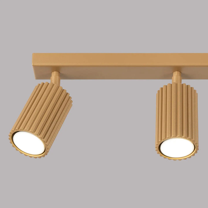 Plafonnier karbon allie finition or avec deux spotlights cylindriques nervurés et ampoules gu10 interchangeables design minimaliste