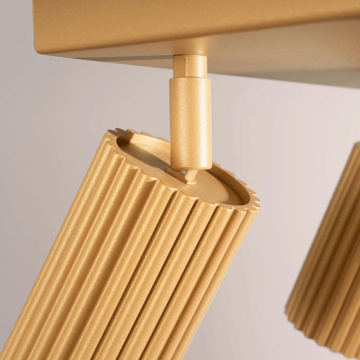 Plafonnier karbon allie design minimaliste en métal doré nervuré avec ampoules gu10 interchangeables