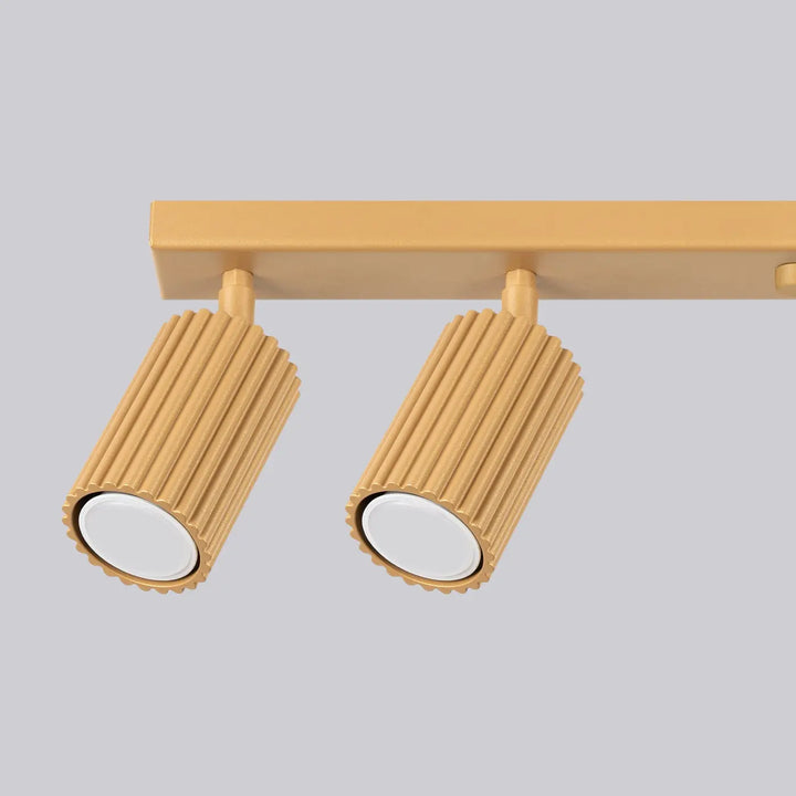Plafonnier karbon allie design minimaliste or avec ampoules gu10 interchangeables et abat-jour cylindrique cannelé