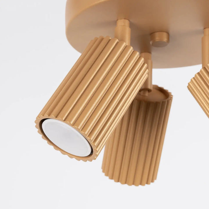 Luminaire plafonnier karbon 3p or avec spots cylindriques dorés à ampoules gu10 interchangeables design minimaliste