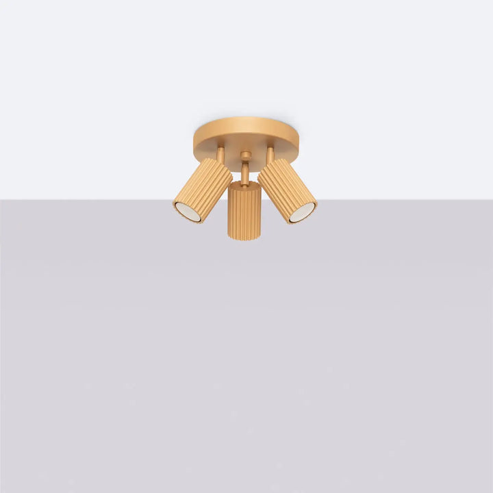 Plafonnier karbon allie design minimaliste or avec trois têtes cylindriques et ampoules gu10 interchangeables