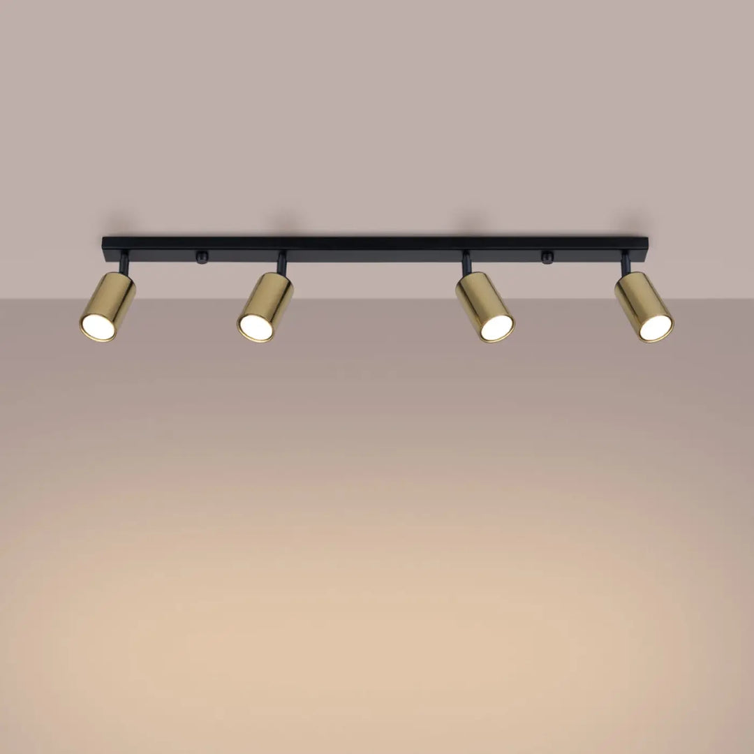 Luminaire plafonnier winx 4l noir avec quatre spots cylindriques dorés allie design moderne et fonctionnalité